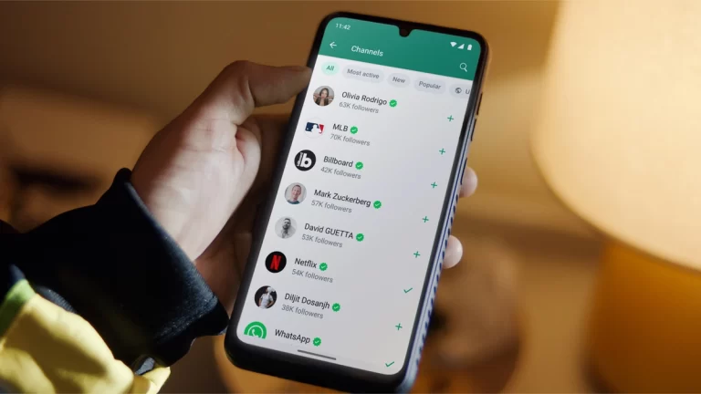 mobile in person hand showing whatsapp channel