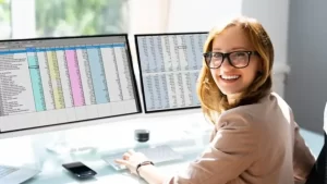 Women smilling with computers screen